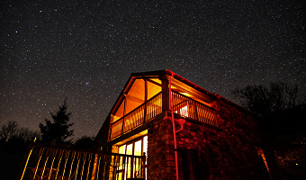 Dan Castell Holiday Cottage at night with stars